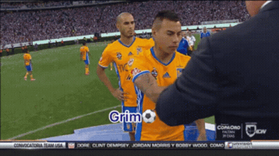 Man In Suit Talking To Soccer Player Grimo GIF