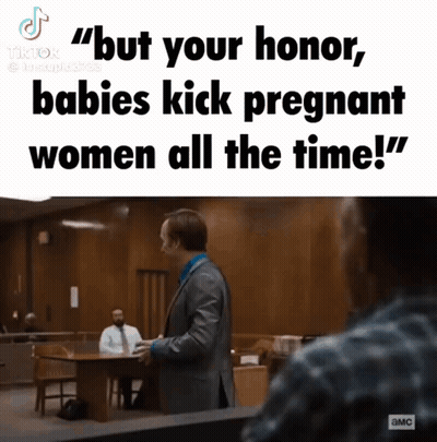 Man In Suit Talking To Woman In Courtroom GIF