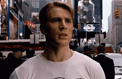 Man In Suit Talking To Woman In Crowd GIF