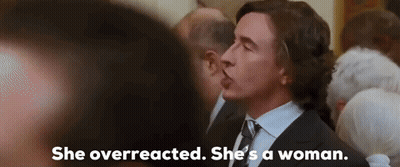 Man In Suit Talking To Woman In Crowd GIF