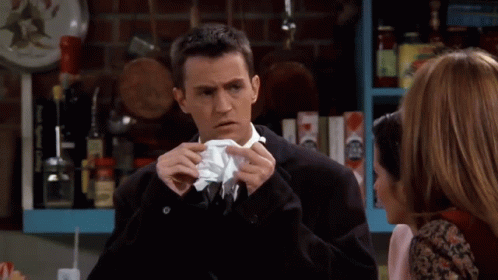 Man In Suit Talking To Woman In Kitchen GIF