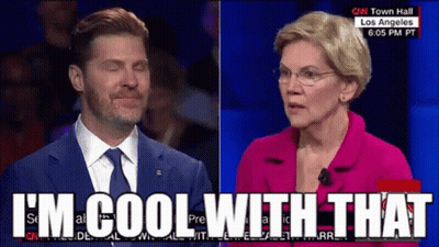 Man In Suit Talking To Woman In Pink Jacket Saying I'm Cool With That GIF