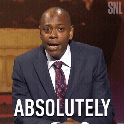 Man In Suit Talking To Woman In Purple GIF