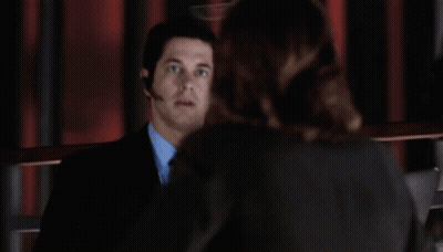 Man In Suit Talking To Woman In Suit GIF