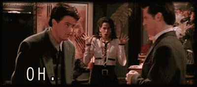 Man In Suit Talking To Woman In White Shirt GIF