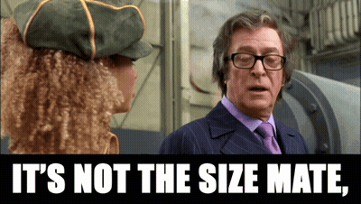 Man In Suit Talking To Woman Saying It's Not The Size Mate GIF