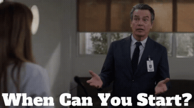 Man In Suit Talking To Woman Saying When Can You Start GIF