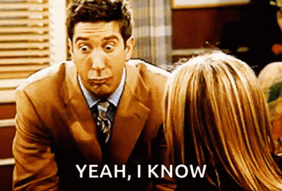 Man In Suit Talking To Woman Saying Yeah I Know GIF