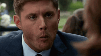 Man In Suit Talking To Woman GIF