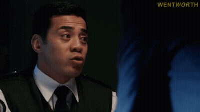Man In Suit Talking With Find Her Behind Him GIF