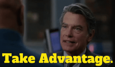 Man In Suit Talks To Another Saying Take Advantage GIF