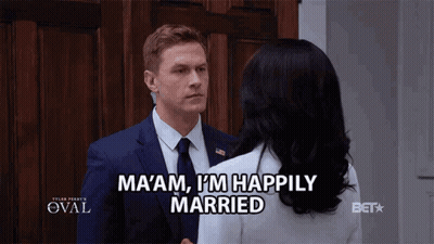 Man In Suit Talks To Woman Saying Ma Am I M Happily Married GIF