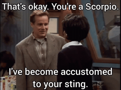 Man In Suit Talks To Woman Saying That's Okay You're A Scorpio GIF