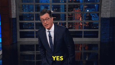 Man In Suit Tie Saying Yes At Window GIF