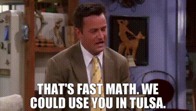 Man In Suit Tie Sitting On Couch Saying That's Fast Math GIF