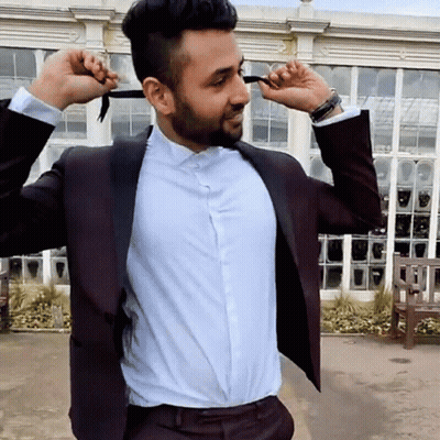 Man In Suit Tying Bow Tie GIF