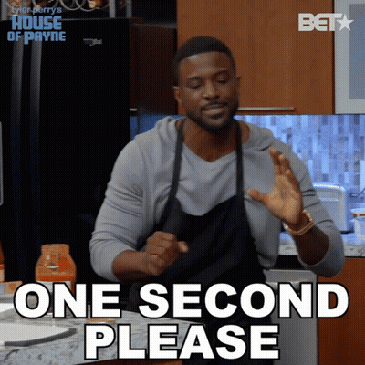 Man In Suit Tying Bow Tie GIF