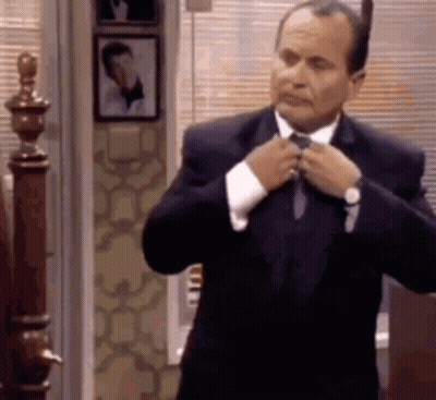 Man In Suit Tying His Tie GIF