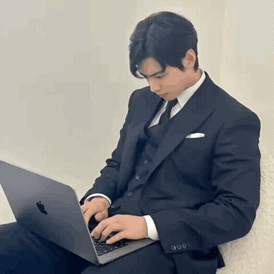 Man In Suit Typing On Laptop GIF