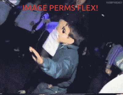 Man In Suit Walking And Looking At Camera GIF