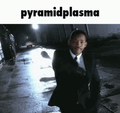 Man In Suit Walking At Night Pyramid Plasma GIF