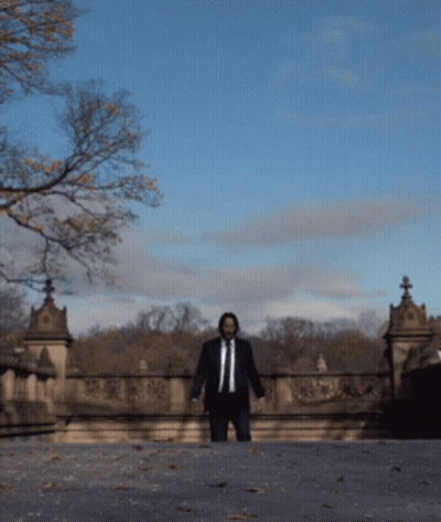 Man In Suit Walking Bridge GIF