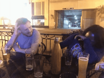 Man In Suit Walking Down City Street At Night GIF