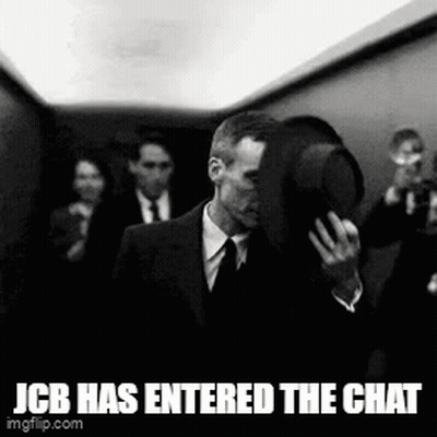 Man In Suit Walking Down Elevator Holding Hat GIF