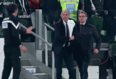 Man In Suit Walking Down Stairs In Front Of Randstad Sign GIF