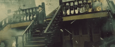 Man in Suit Walking Down Stairs