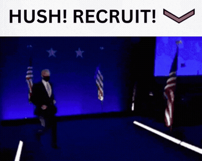 Man In Suit Walking On Stage With Hush Recruit GIF