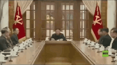 Man In Suit Walking Past Global News Logo GIF