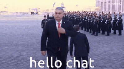 Man In Suit Walking Past Military Parade Saying Hello Chat GIF