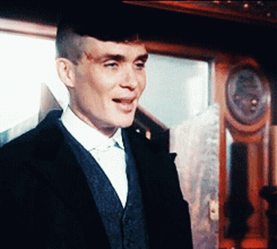 Man In Suit Walking Through Field GIF