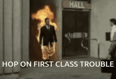 Man In Suit Walking Through Flaming Door Hop On First Class Trouble GIF