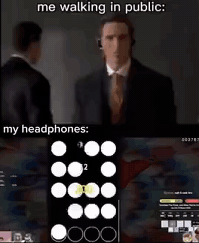 Man In Suit Walking With Headphones GIF