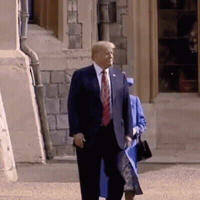 Man In Suit Walking With Woman In Blue Coat GIF