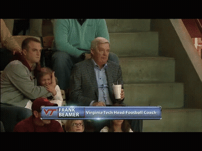 Man In Suit Watching Football With Frank Beamer GIF