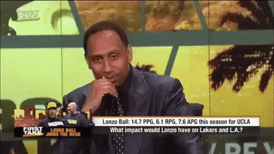 Man In Suit Watching TV Saying First Take GIF
