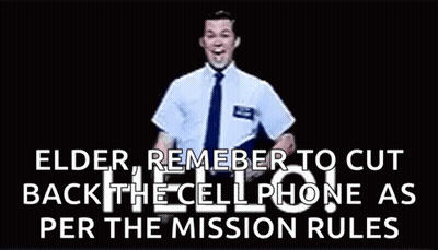 Man In Suit Waving At Camera GIF
