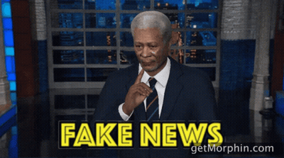 Man In Suit Waving At Fake News GIF