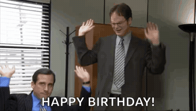 Man In Suit Waving Hands While Another Says Happy Birthday GIF