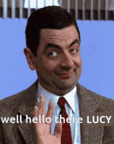 Man In Suit Waving Hello There Lucy GIF