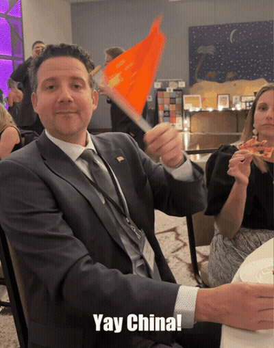 Man In Suit Waving Orange Flag Yay China GIF