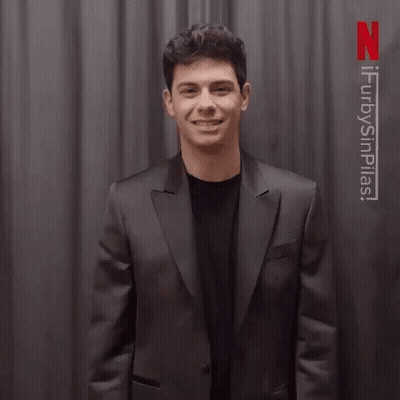 Man In Suit Waving Saying Gracias GIF