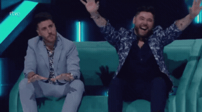 Man In Suit Waving Saying Gracias GIF