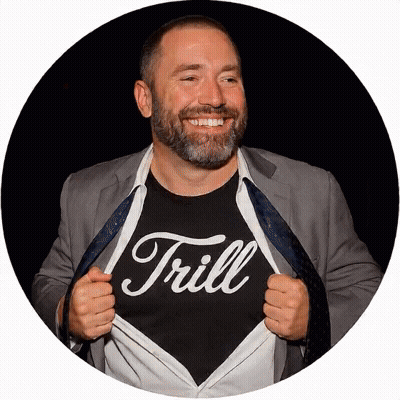 Man In Suit Wearing Trill Shirt GIF
