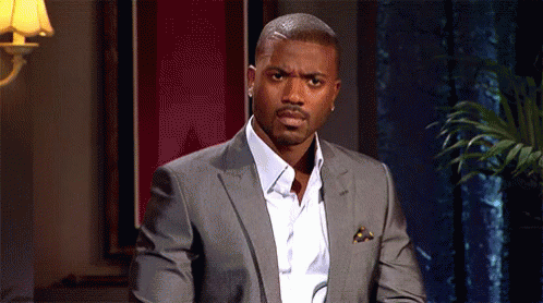 Man In Suit White Shirt Looking At Camera GIF