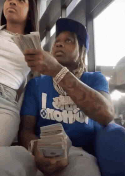 Man In Suit Wiped With Towel By Another Man GIF