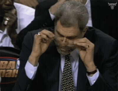 Man In Suit Wiping Nose GIF